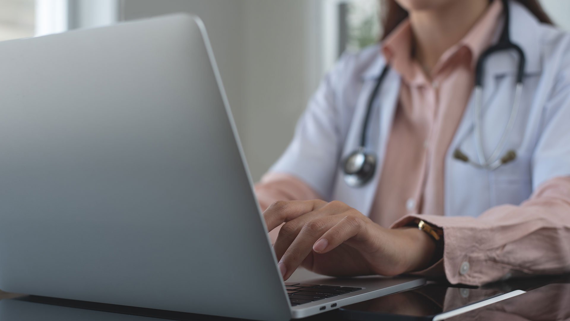 Doctor working on computer